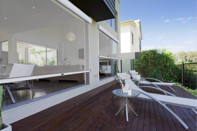 A zip blind enclosing a covered deck.